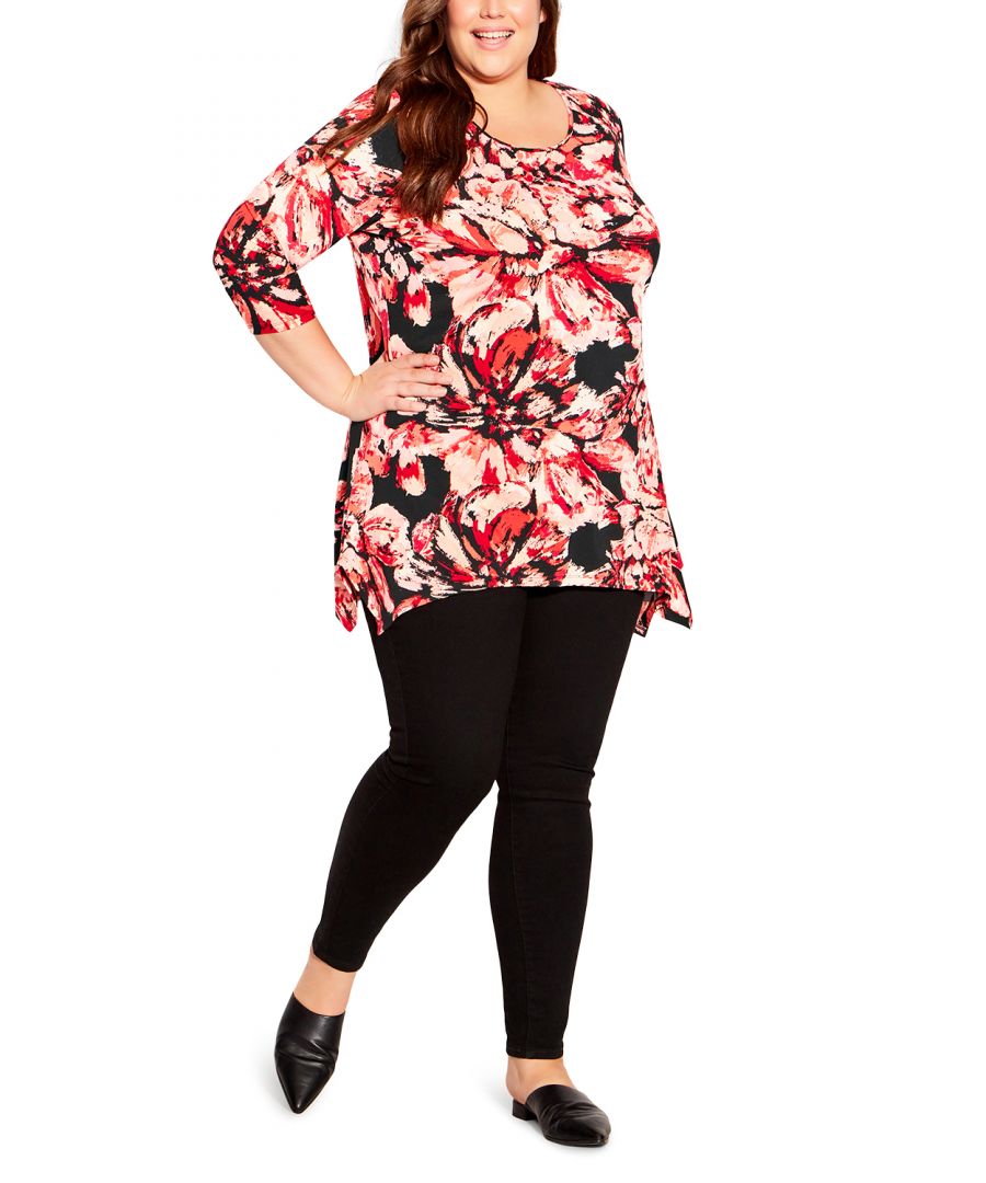 Fit and flatter your curves in the Cosmic Print Tunic. This lively style features a round neckline, 3/4 length sleeves, and a sharkbite hemline. Key Features Include:-Round neckline-3/4 length sleeves-Relaxed silhouette-Pull over style-Sharkbite hemline