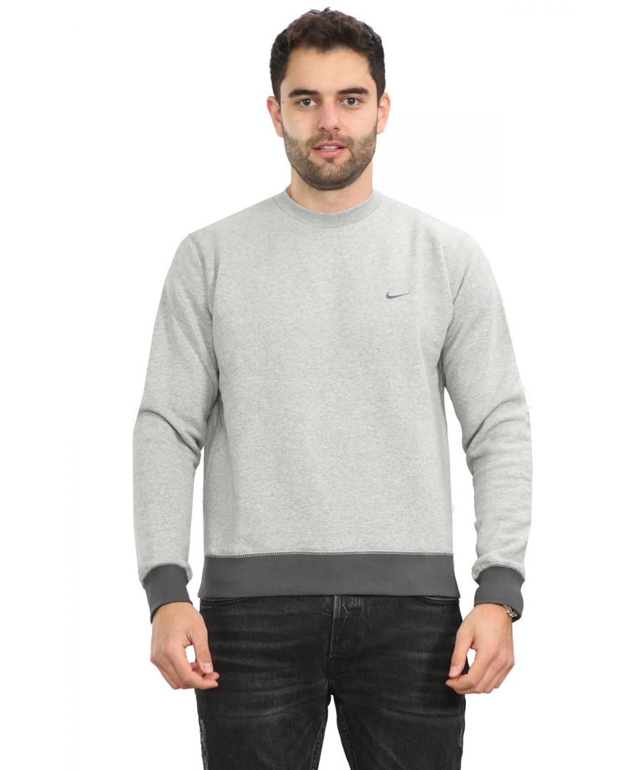 Nike Mens Crew Neck Sweatshirt.  \nContrast Coloured Embroidered Nike Swoosh Stitched on the Left Side of The Chest.   \nSoft Warm Brushed Back Fleece Inner.  \nContrast Coloured Ribbed Cuffs and A Contrast Coloured Ribbed Hem.  \nComfortable and Lightweight Sweat.