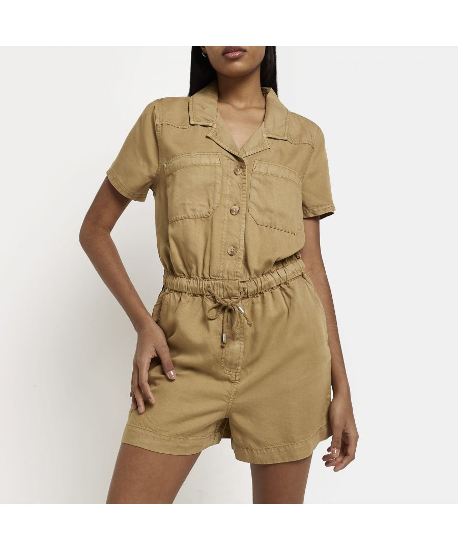 > Brand: River Island> Department: Women> Material: Lyocell> Material Composition: 100% Lyocell> Type: One-Piece> Style: Playsuit> Size Type: Regular> Fit: Regular> Neckline: Collared> Sleeve Length: Short Sleeve> Leg Style: Straight> Pattern: No Pattern> Occasion: Casual> Selection: Womenswear> Season: SS22