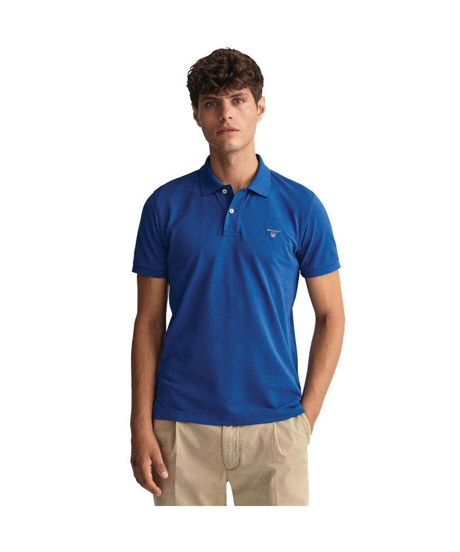 These Original Mens Designer Short Sleeve Gant Polos feature the brands Logo, a Contrasting Trim and a Button-Down Collared Neckline. Crafted With 100% Cotton, these Lightweight and breathable Regular Fit Polos are Suitable for Casual or Workwear.