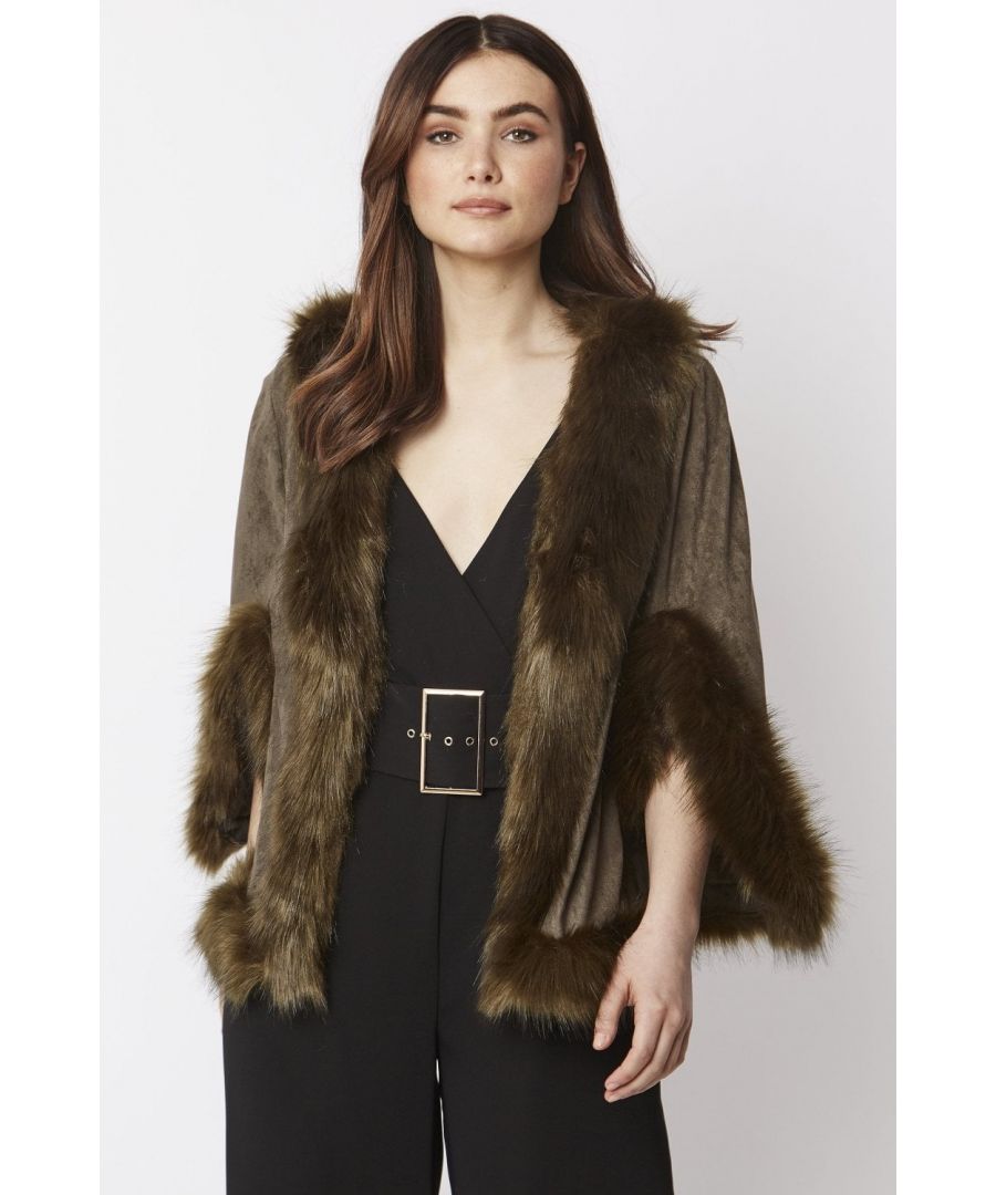 Immerse yourself in effortless luxury with this elegant, decadent faux suede cape with matching faux fur trim. Our luxurious cape can be worn to complete a modern layered look on those chilly days.
