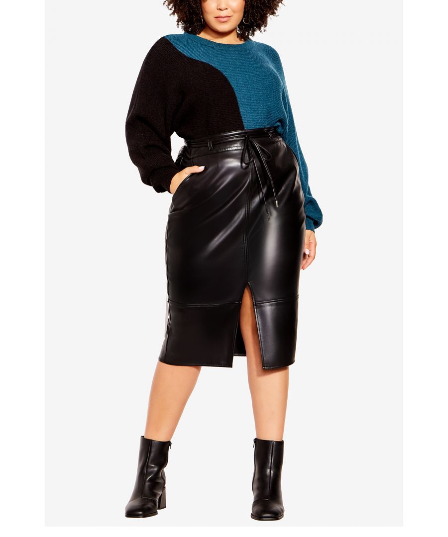 Looking for a skirt that will make you look and feel your best? Check out the Celine Skirt! Made from a sultry faux-leather fabric, this skirt is designed to show off your curves. It features a thick waistband, a centre split, and side zip closure. Plus, it comes with a matching self-tie belt that can be removed for a more versatile look. Key Features Include: - Thick waistband - Thin, removable & matching self-tie belt - Size zip closure - Functional side pockets - Centre slit at hem - Below knee length