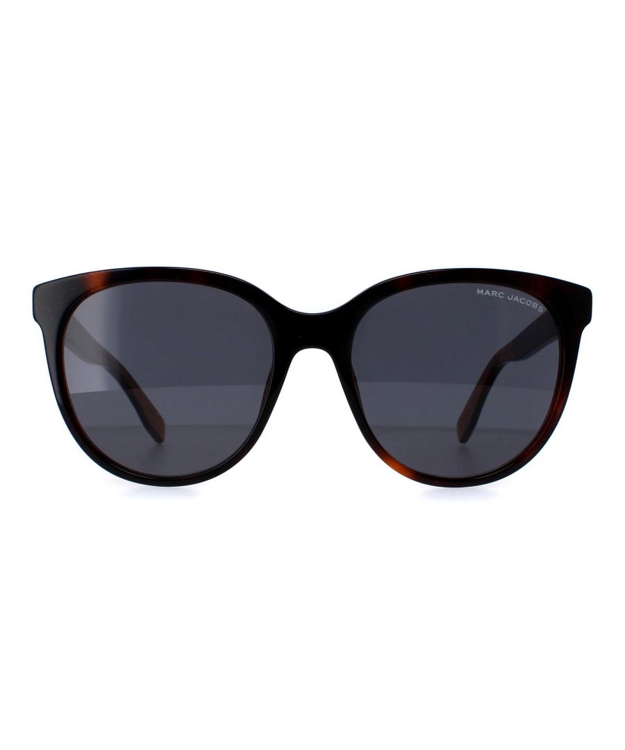 Marc Jacobs Round Womens Havana Grey MARC 445/S  Sunglasses feature a modern, round design with a bold, full-rim frame. The frame is made from high-quality, lightweight acetate, ensuring durability and long-lasting wear. The temples are accented with the iconic Marc Jacobs logo, adding a touch of elegance to the overall look.