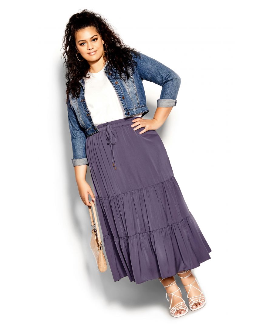 Dream up the perfect summer outfit with our effortlessly chic and youthful Summer Tier Skirt. Featuring stylish tiering and a comfortable elasticated waistline, this midi skirt drapes elegantly over your curves. Key Features Include: - Elasticated drawstring waistline - Tiered design - Flared silhouette - Pull up style - Fully lined - Midi length