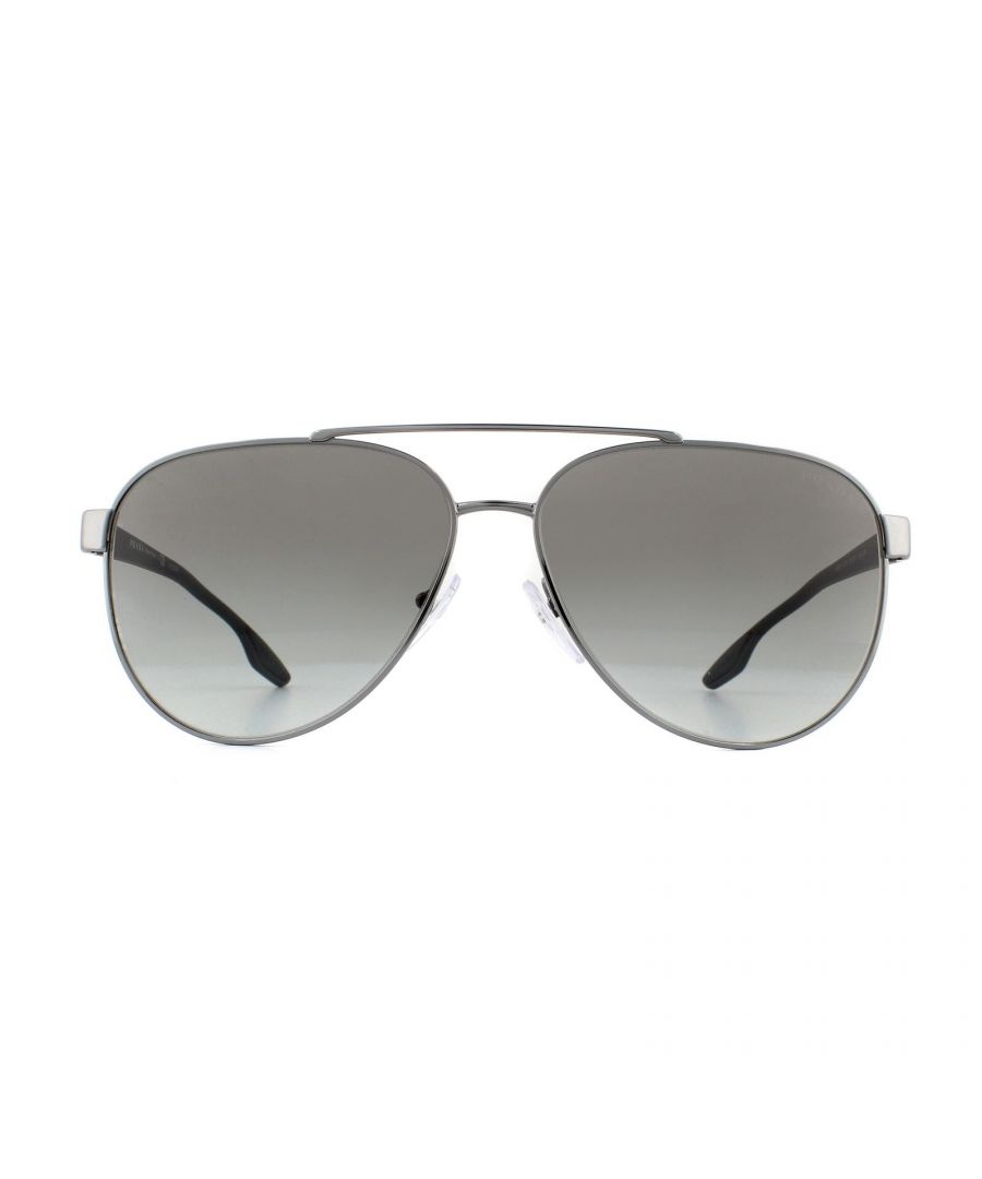 Prada Sport Sunglasses PS54TS 5AV3M1 Gunmetal Grey Gradient are Italian made classic metal aviator style sunglasses featuring a very fine brow bar. The slimline temples are made from plastic, have rubber inserts at the temple tips for grip and feature the iconic red branded detailing at the hinges.