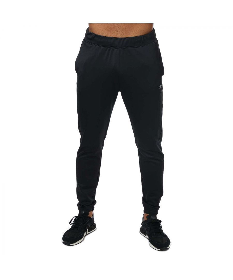 Mens Champion Pf Poly Joggers in black.- Elasticated waist with innerdrawcord.- Side welt pockets.- Zipped rear pocket.- Reflective C logo at left hip.- Elasticated cuffs.- Custom fit.- Body: 91% Polyester  9% Elastane.  Insert: 60% Cotton  40% Polyester.  Rib: 59% Cotton  39% Polyester  2% Elastane.  Machine washable.- Ref: 218274 KK001