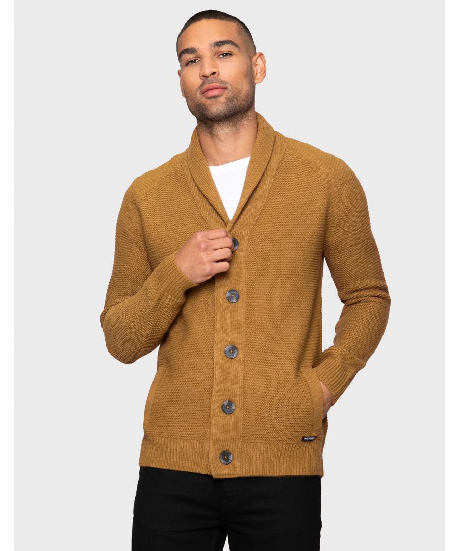 This stylish, button through, knitted cardigan from Threadbare features a textured stitch knit design and a shawl collar. This style has a ribbed hem and cuffs and is ideal for layering. A great piece for keeping warm this season. Other colours available.