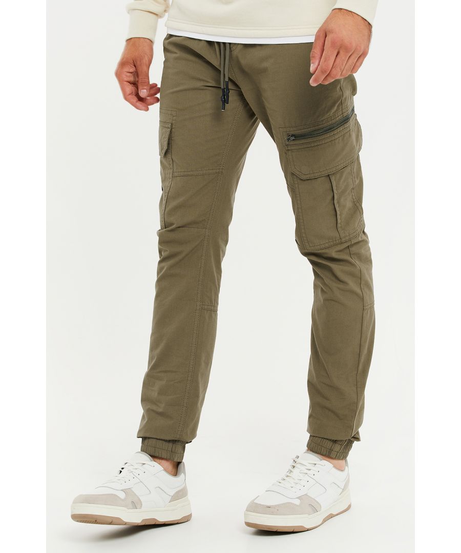 These pull-on, cuffed cargo trousers from Threadbare have an elasticated waist with drawstring. They feature front and back pockets, cargo pockets on the legs, and a mock zip pocket on the left leg. Made from cotton for a really comfortable fit. Other colours available.