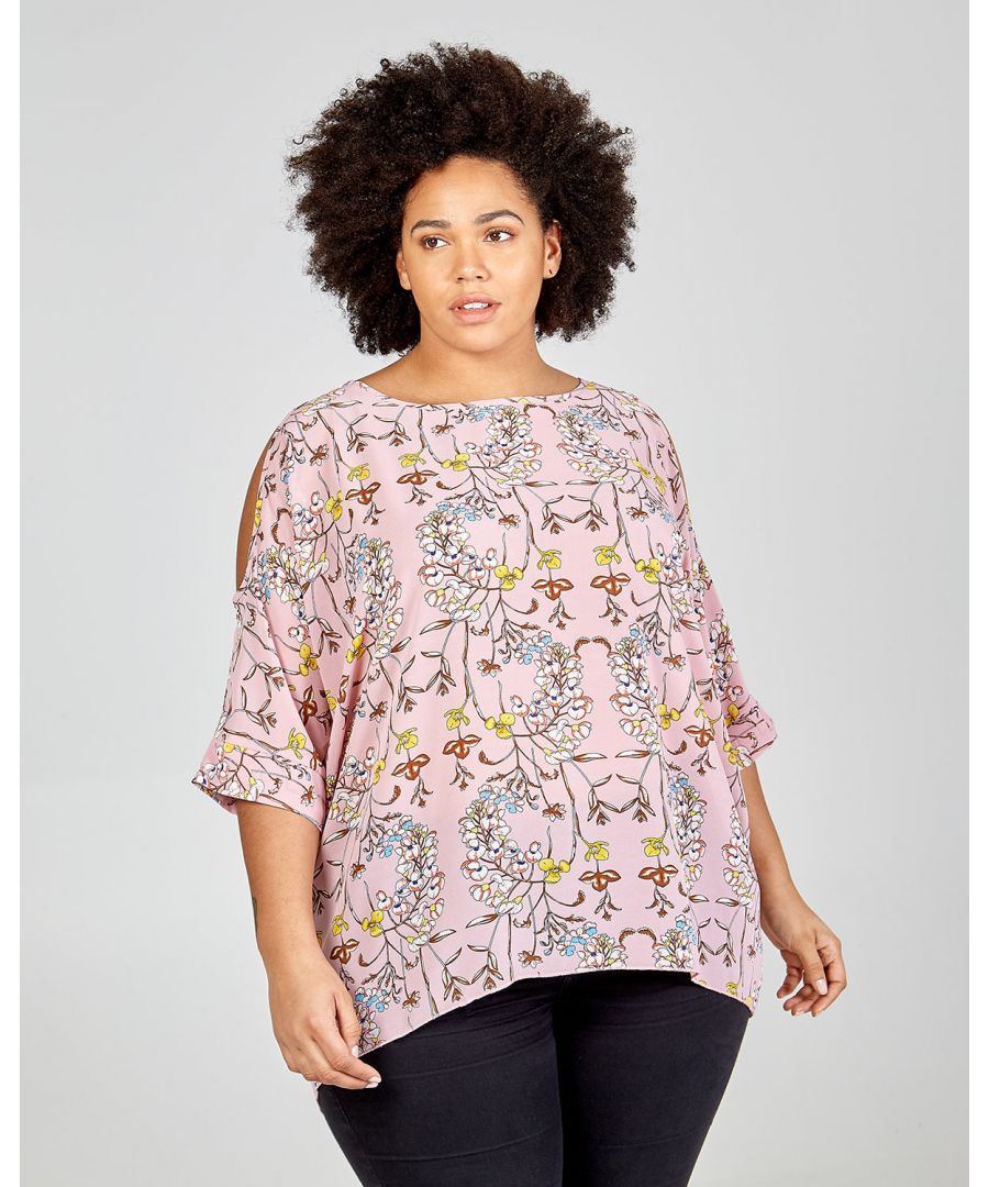 Bring the charm out this spring with this lovely cold shoulder top in a romantic pink floral print and soft wave lines that flow around the body. Match it with jeans and flats for a dreamy look.\nConstruction: 100% Polyester, Gentle wash at 40 degrees, Do not bleach, Do not dry clean, Do not tumble dry, Iron on low heat,,