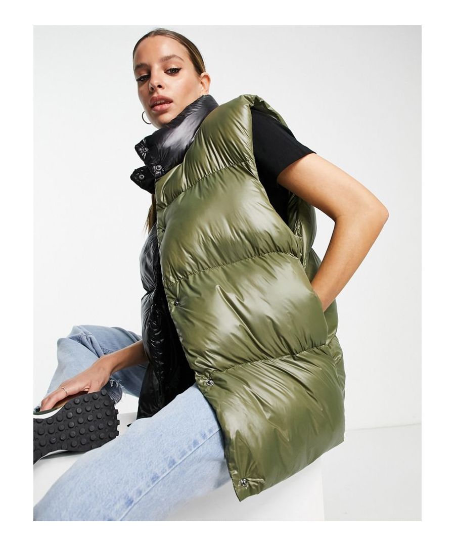 Tall gilet by ASOS DESIGN The scroll is over Colour-block design High neck Press-stud placket Sleeveless style Functional pockets Regular fit  Sold By: Asos