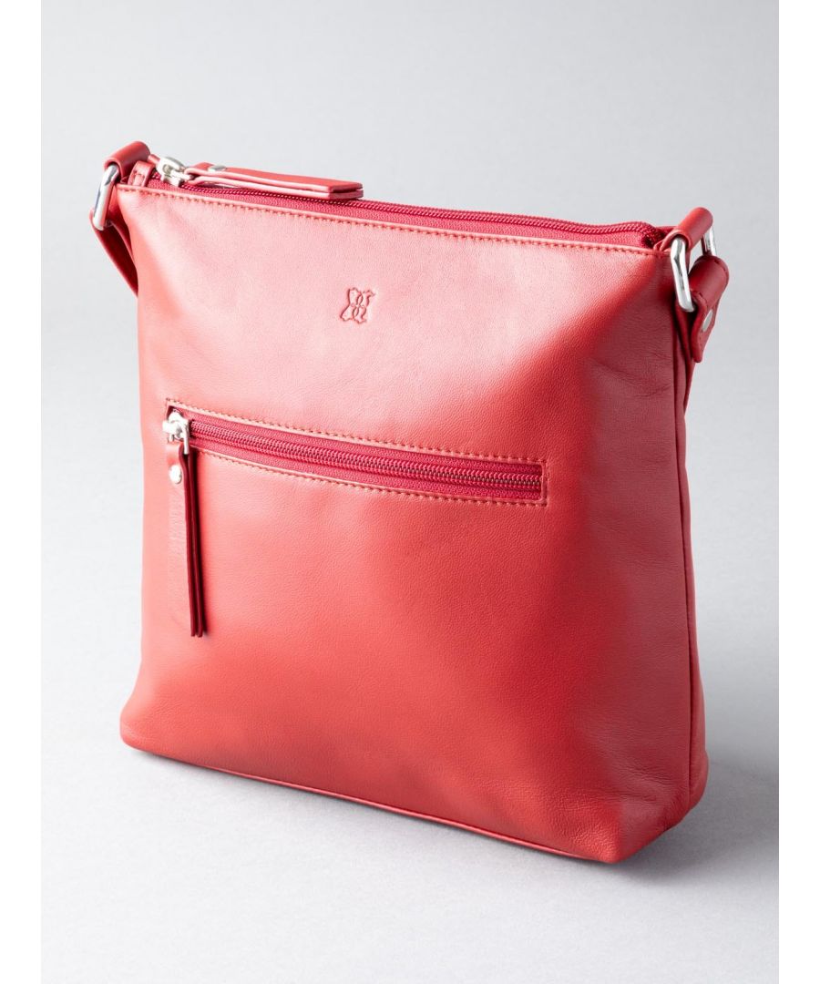 The Tally Cross Body Bag is a classic design in an easy to wear soft red leather. With an adjustable shoulder strap and zipped main compartment, it is a great size to hold all of your daily essentials. It also comes complete with a handy zipped side pocket and an internal zip pocket to help keep your belongings organised. The perfect addition to brighten up your outfit.