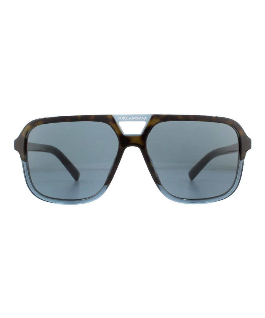 Dolce & Gabbana Sunglasses DG4354 320980 Havana Transparent Blue Brown Gradient are a full acetate square style aviator for men. The lightweight frame features the Dolce & Gabbana text logo on each of the hinges an d the brow bar. The DG logo is also featured at each of the temple tips. The 4354 are a sleek and contemporary style that will guarantee you stand out from the crowd!