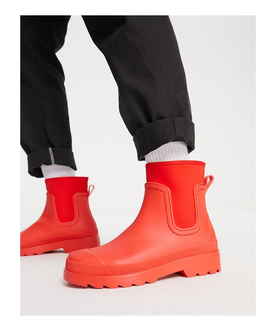 Wellies by ASOS DESIGN Save them for a rainy day Pull tab for easy entry Scuba-style inserts Round toe Chunky sole Lugged tread  Sold By: Asos