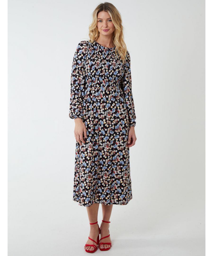 If you are concerned about how to keep your elegancy during the colder months, allow us to introduce you to this smock dress. It has a back tie, floral print, long sleeves and a high neckline. Perfect to keep you warm. Thanks to its fabrics, this midi dress is also highly elasticated. You will not go wrong styling this dress with black tights and high heel boots. Layer with a warm wool coat, and finish off with a tote bag.
