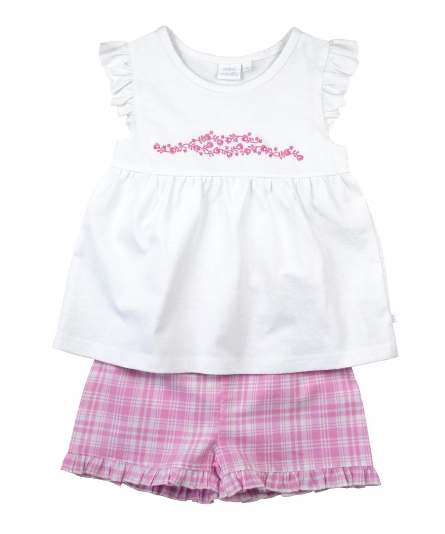 These comfortable shortie pyjamas for girls are made from soft cool cotton and feature a unique check that was created by our in-house design team. Complete with a complementary white woven top with pretty cap sleeves and dainty embroidery. The short has  fully elasticated waist with a frilled hem. They are sure to become a new bedtime favourite in the hot summer months!\n\nDesign & Fit\n\nClassic white short sleeve top and shorts\nPretty Embroidery\nElasticated waistband\nEasy, pull-on style\nFabric and Care\n\n100% cotton seersucker\nMachine wash\nSafety warning: keep away from fire