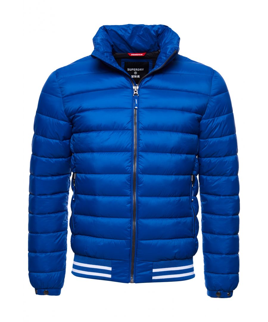 Combining a puffer jacket with a Bomber jacket, the Fuji Bomber jacket features an all-over padded design, a main zip fastening and a ribbed hem with striped detailing.Slim fit – designed to fit closer to the body for a more tailored lookRecycled paddingMain zip fasteningPopper cuffsTwo zip pocketsRibbed hem with striped detailingSignature logo patchThe padding in this jacket is 100% recycled, each jacket contains up to 30 recycled bottles, this avoids these bottles being sent to landfill or polluting our oceans.