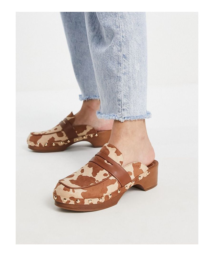 Mules by ASOS DESIGN Who needs the back of a shoe? All-over cow print Slip-on style Apron toe Flat sole Low block heel Sold by Asos