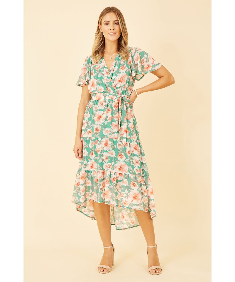 An update on our best selling shape. This Mela dress features a midi length dip hem, self tie waist and of course that stunning wrap front shape. The floral print adds something special to this gorgeous dress. Perfect paired with sandals for summer holidays.