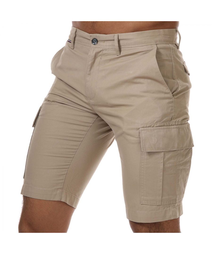 Mens Tommy Hilfiger Cargo Shorts in beige.-  Button and zip fastening.- Two front angled pockets.- Two side cargo pockets.- Tommy Hilfiger branding.- Tommy Hilfiger flag embroidery at back pocket.- Regular fit.- 100% Cotton.- Ref: MW0MW13520AEG