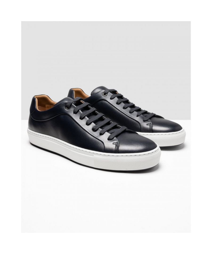 Elegant trainers crafted in Italy by BOSS. Stamped with a BOSS logo at the backtab, these rubber-sole trainers are designed with a low profile in smooth leather with hand-finished burnishing.\nUpper material: 100% Cow skin, 100% Goat leather, 100% Cow skin, 100% Calfskin, Sole: 100% Rubber, Innersole: 100% Calfskin\n50472128