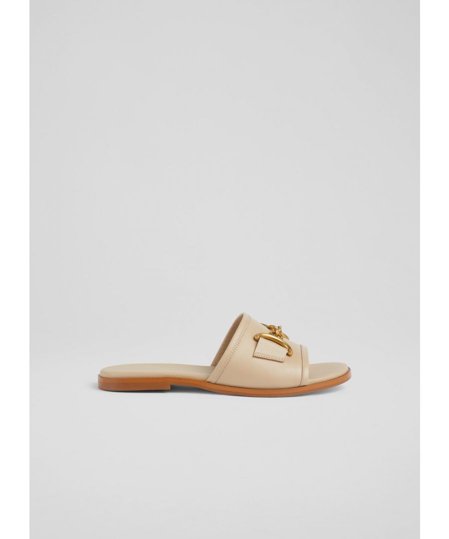 Cool, comfortable and chic, our Piper sliders are all we can ask for from a casual summer shoe. Crafted in Spain from super-soft taupe nappa leather, they're a simple slip-on mule with a Seventies-inspired gold snaffle detail and a small flat heel. Slide them on with your favourite summer skirts or even with relaxed tailored pieces.