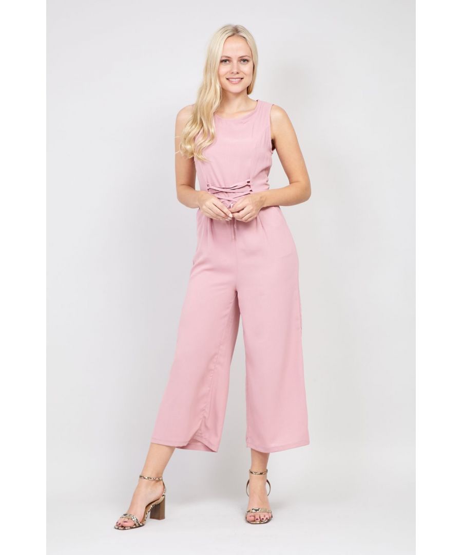 Go girly in this super cute pink jumpsuit. It has a lace up front, round neck a lace up detail back and wide cropped legs. Wear with block heels for a night out.