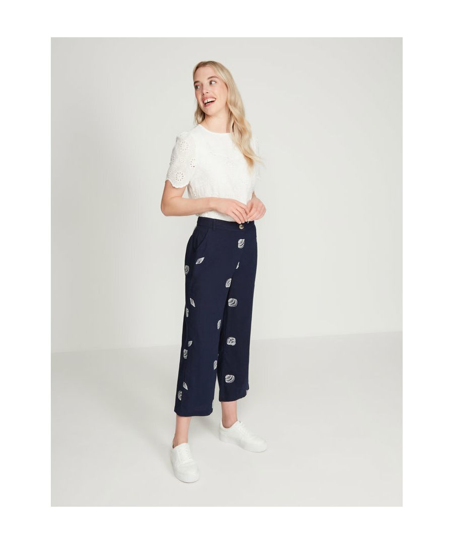 These navy linen trousers from cost clothing have been embroidered with white seashell detailing. Style with a white t-shirt and sandals for an on trend look.
