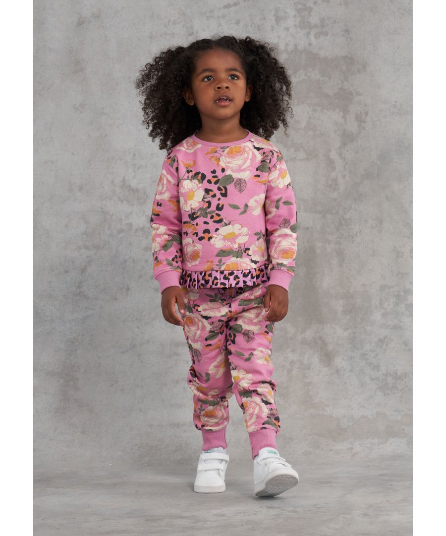 Opt for fun florals with this super cute sweatshirt. Beautiful blooms printed on a super soft loopback. The sweatshirt has a pleated satin hem and keyhole opening  the matching jogger has an elasticated waist joggers with satin bow and trainers for a cute co-ord.  Angel & Rocket cares – made with fairtrade cotton.  Foxglove  About me: 95% cotton 5% polyester  Look after me – Think planet  wash at 30c