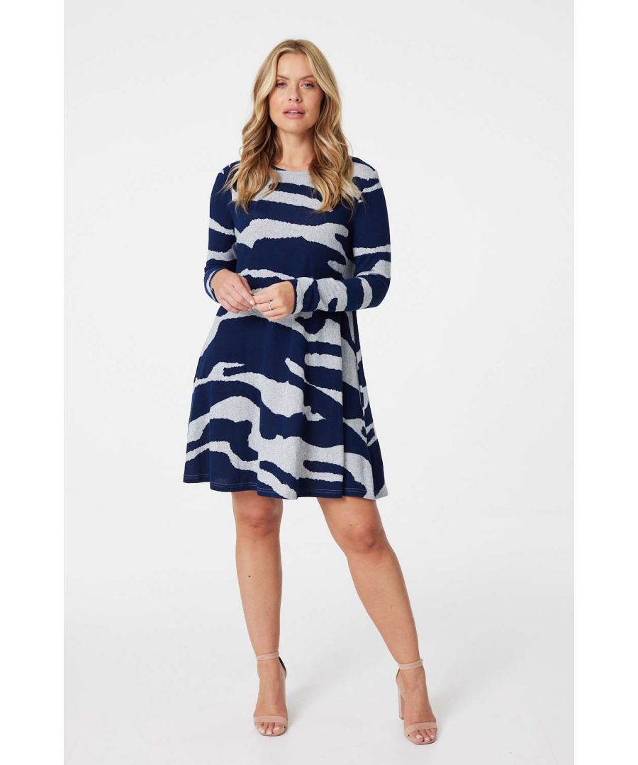 Add a statement zebra print swing dress to your cosy jumper dress collection. With a round neck, long sleeves, pockets and a short flared skirt. Style with nude heels for an elevated yet casual outfit or dress down with trainers.
