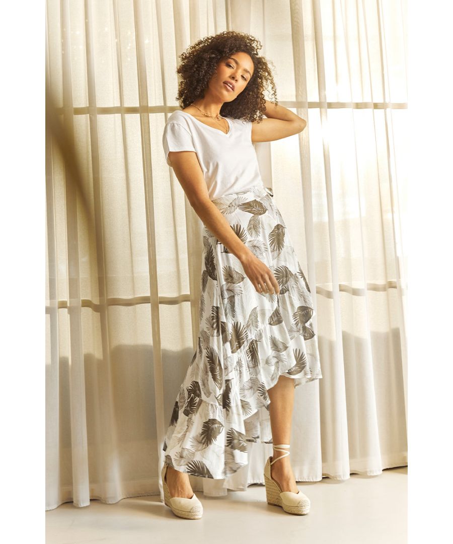 Every wardrobe needs a flattering midi skirt like this tropical print wrap skirt. With a high waist, a tie detail side, a wrapover skirt with a frilled high low hem and a classic midi length. Pair a white t-shirt and nude espadrille heels for an elevated daytime outfit.