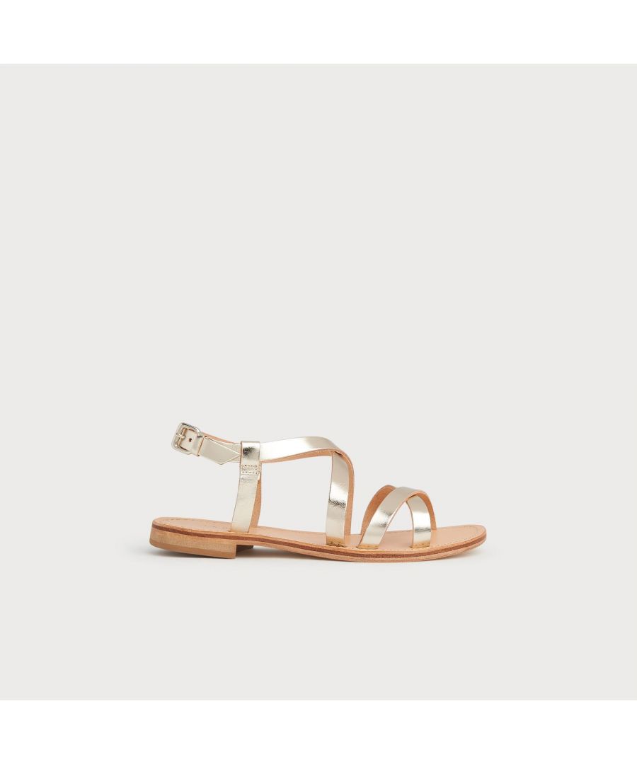 A Greek sandal is a summer staple, and our Fallon sandals are the perfect example. Crafted from vachetta leather in gold, they crossover the toes and across the foot and fasten with a buckled ankle strap. Wear them with lightweight cotton and linen pieces when the sun shines.