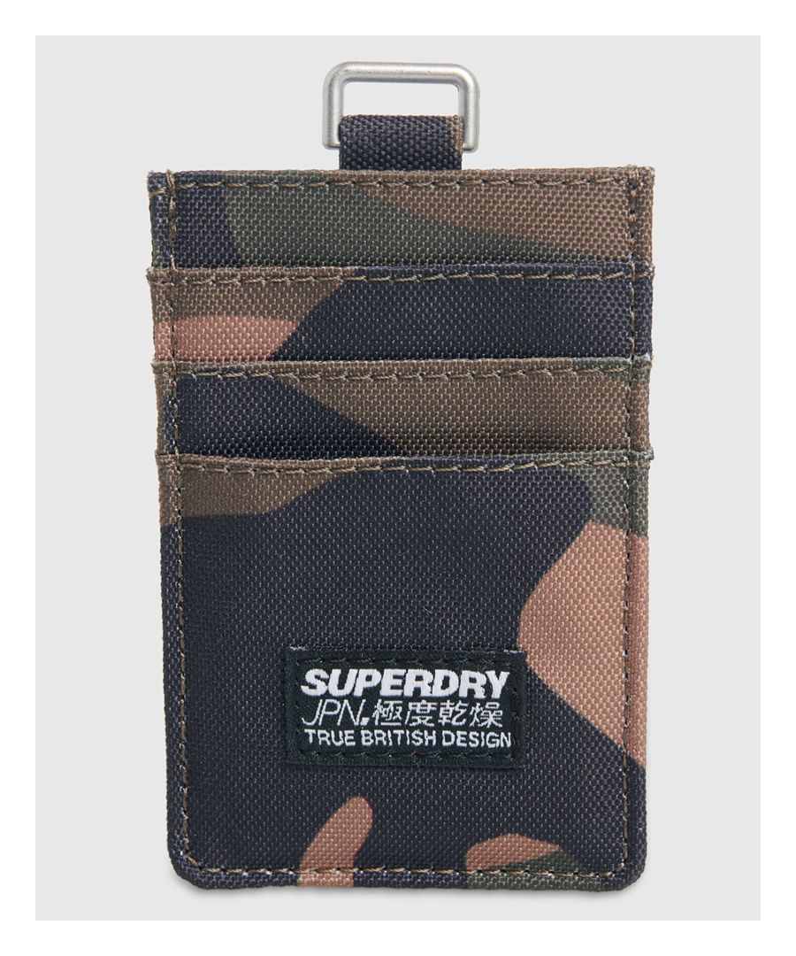 Superdry men's Fabric card holder. This card holder features six card slots, and a larger slot down the middle for notes or receipts. The card holder is finished with a Superdry logo patch on one side.H 10cm x W 6cm