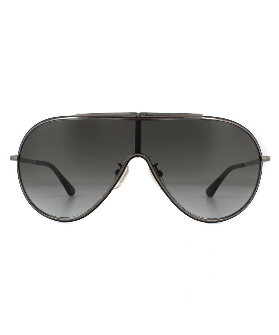 Police Sunglasses SPL964 Origins 10 0K56 Shiny Gunmetal Smoke Grey Gradient  are a large shield style with one large lens, a metal frame front and temples with plastic tips for comfort. Temples are decorated with the Police logo.