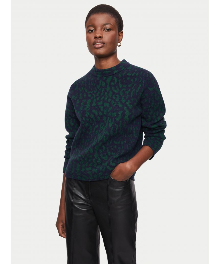 Knitted in a luxe wool blended yarn our new Snow Leopard combines rich green with navy for a subtle modern animal. Jacquard construction gives lovely texture and structure to this easy fitting boxy knit. High crew neckline, relaxed dropped shoulder with easy fitting long sleeves.