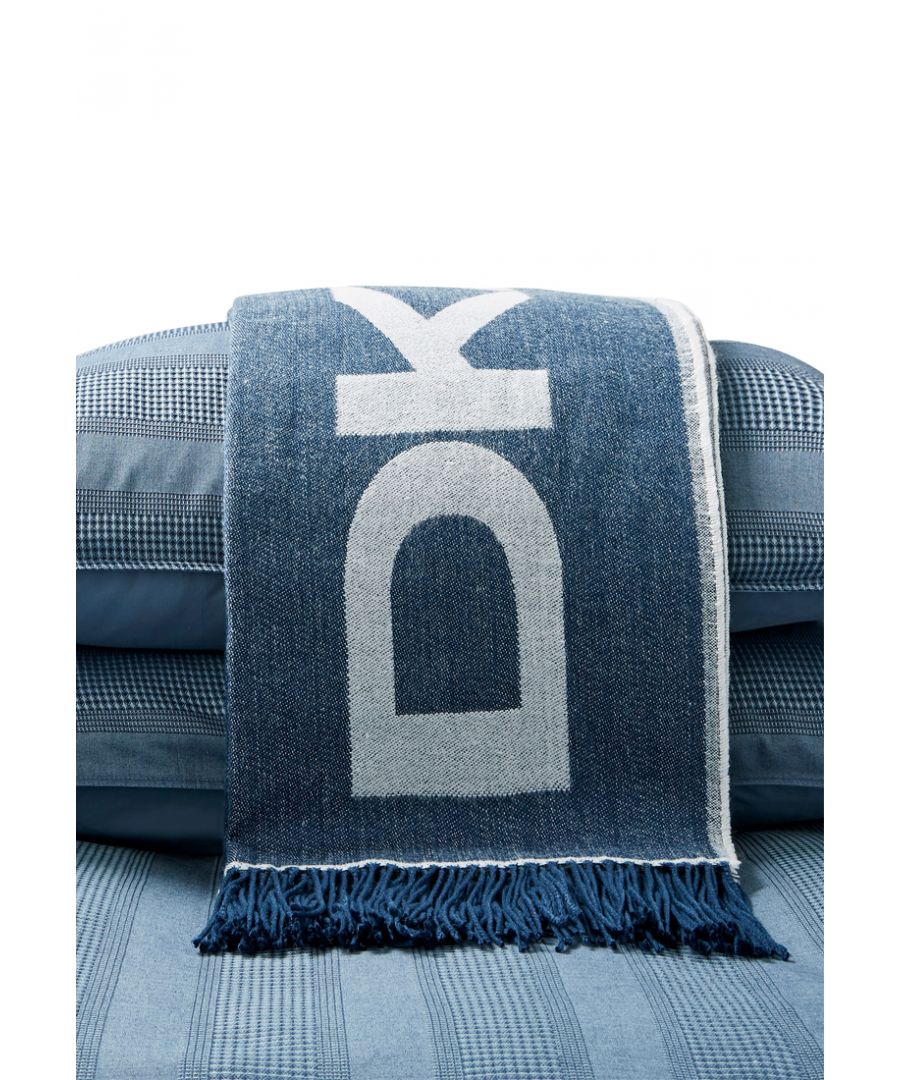 The DKNY Woven Throw adds a cosy touch to any couch, bed, or chair. Its soft texture and iconic DKNY logo set against three classic colours will create an instant fashion flair to your space. Available in three timeless combinations: Navy & White/ Grey & White/ Black & Grey