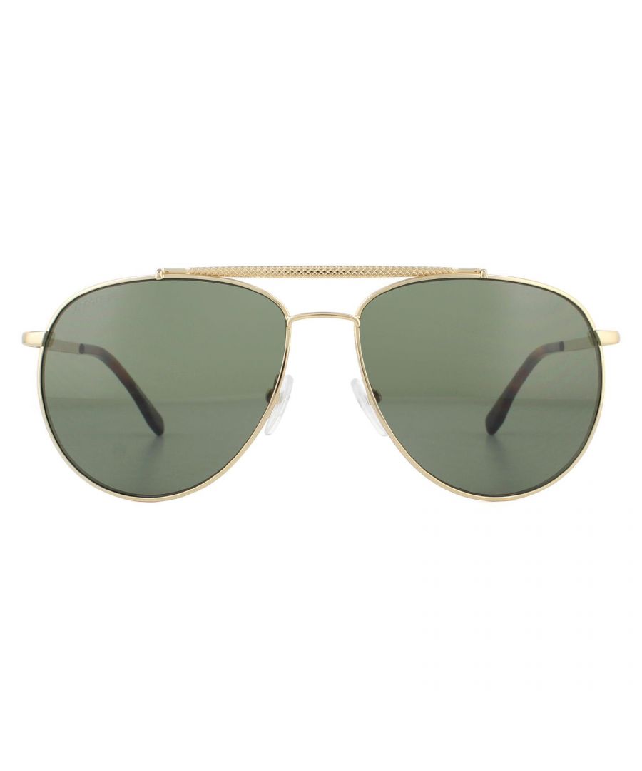 Lacoste Sunglasses L177S 714 Gold Grey are a classy pilot style with textured temples and matching brow bar for a luxurious chic finish. The Lacoste lettered logo at the temples completes these cool aviator Lacoste shades.