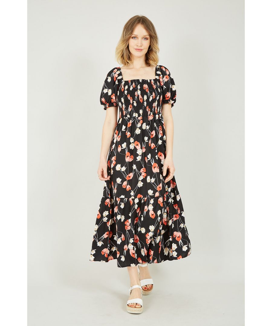Beautifully designed in pretty orange and white florals, this Black Floral Midi dress is a versatile wardrobe hero. Complete with puff sleeves and a feminine fit, dress up or down whatever the occasion. The lightweight fabrics adds comfort to this gorgeous black floral dress, perfect for dinners and long summer walks. Complete the look with sandals, a mini shoulder bag and a nude lip works a treat too! Want to make a bold statement? A red lip!