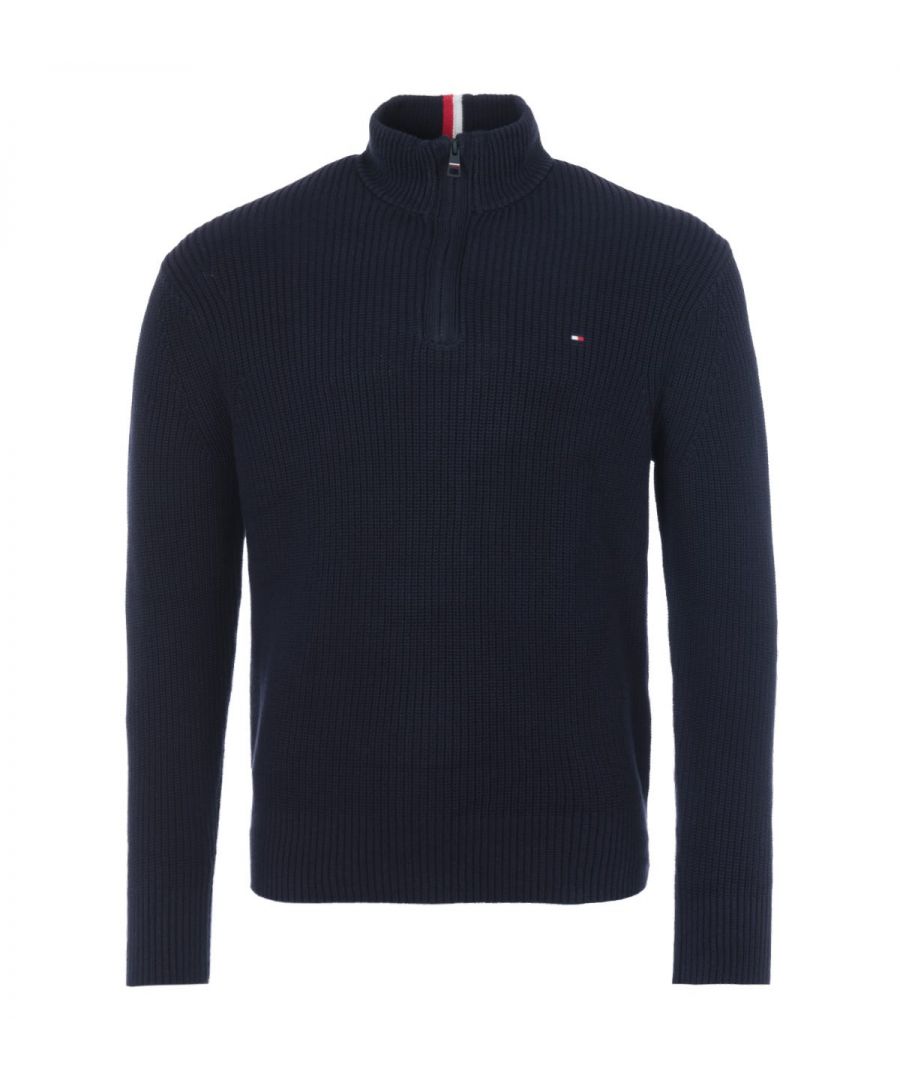 For a seriously cosy feel, this ribbed half zip sweater from Tommy Hilfiger is the perfect piece to refresh your wardrobe with sustainable style. Knitted from pure organic cotton in a relaxed fit. Featuring a funnel neck with a half zip fastening, long sleeves and a thick ribbed texture. Finished with the iconic Tommy flag logo embroidered at the chest. Relaxed Fit. Organic Cotton Knit. Thick Ribbed Texture. Funnel Neck Half Zip Fastening. Long Sleeves. Tommy Hilfiger Branding. Style & Fit: Relaxed Fit. Fits True to Size. Composition & Care: 100% Organic Cotton. Machine Wash