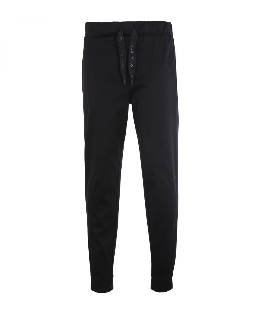 The Ottoman joggers from BOSS are crafted from shiny cotton, providing a super soft luxurious feel and are the perfect addition to your loungewear wardrobe. Featuring an adjustable drawstring waistband, twin side seam pockets and elasticated cuffs. Regular Fit, Pure Cotton, Adjustable Drawstring Waist, Twin Side Seam Pockets, Elasticated Ankle Cuff, BOSS Branding. Style & Fit: Regular Fit, Fits True to Size. Composition & Care: 100% Cotton, Machine Wash.