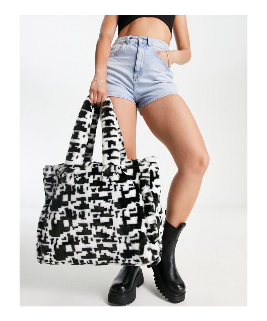 Tote bag by ASOS DESIGN The bag your stuff deserves White noise print Twin handles Magnetic closure Internal zip pocket Sold by Asos