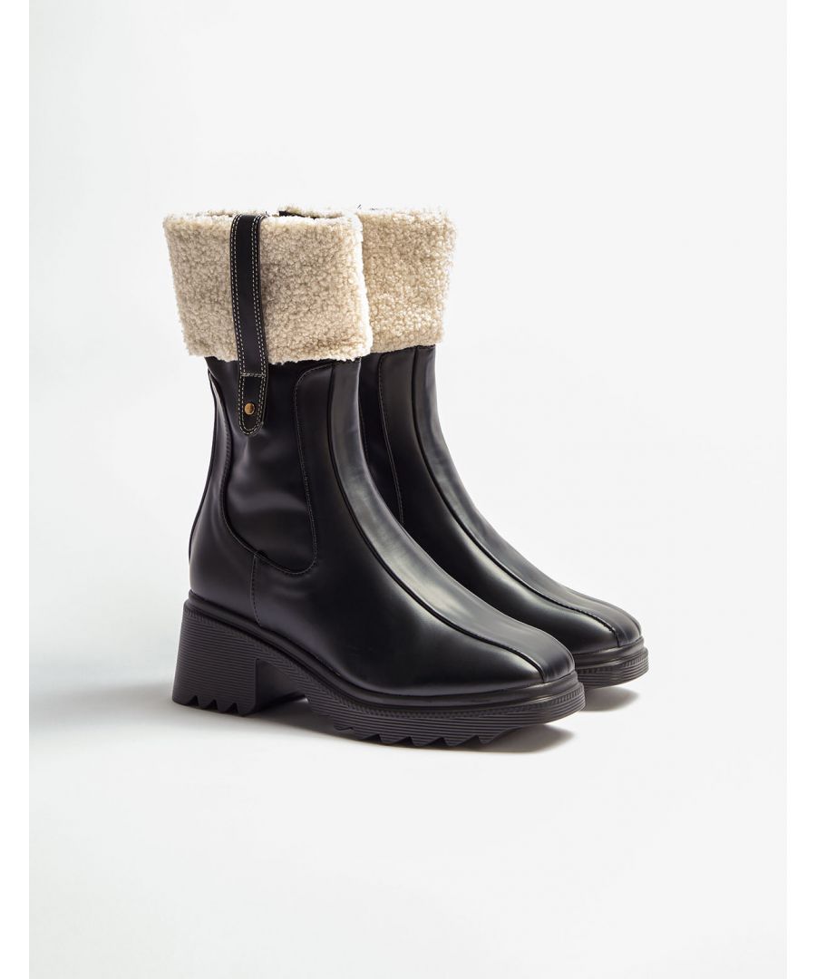Here's an update on your traditional rain boots, these faux fur boots will have you looking super trendy on those wet and rainy days!\nUpper Material: SyntheticLining Material: SyntheticSole: Rubber