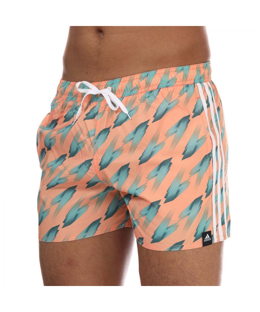 Mens adidas Graphic Swim Shorts in orange.- Elasticated waist with drawcord.- Side pockets.- Inner mesh briefs.- Ergonomic seams.- Quick drying.- Shell: 100% Polyester (Recycled). Inner Brief: 100% Polyester (Recycled).- Ref: GM2252