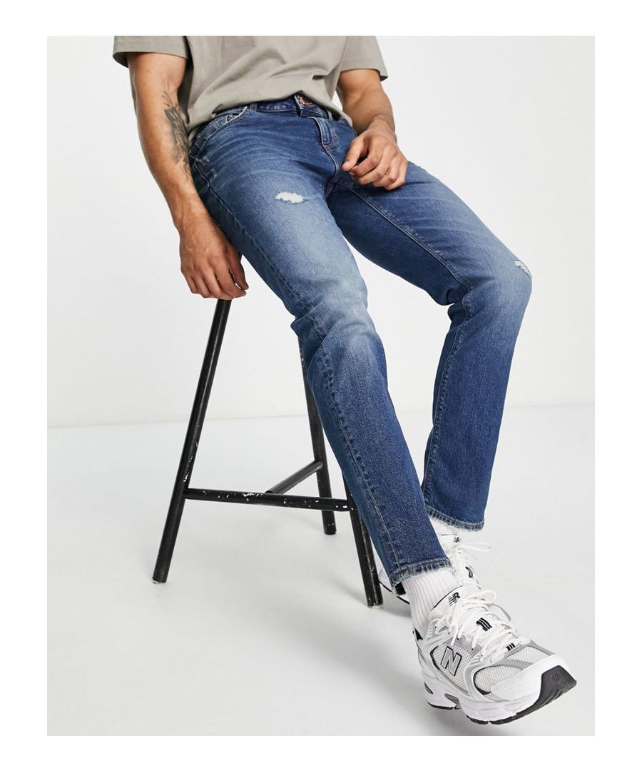 Slim jeans by ASOS DESIGN Distressed finish Regular rise Belt loops Five pockets Slim fit Sold by Asos