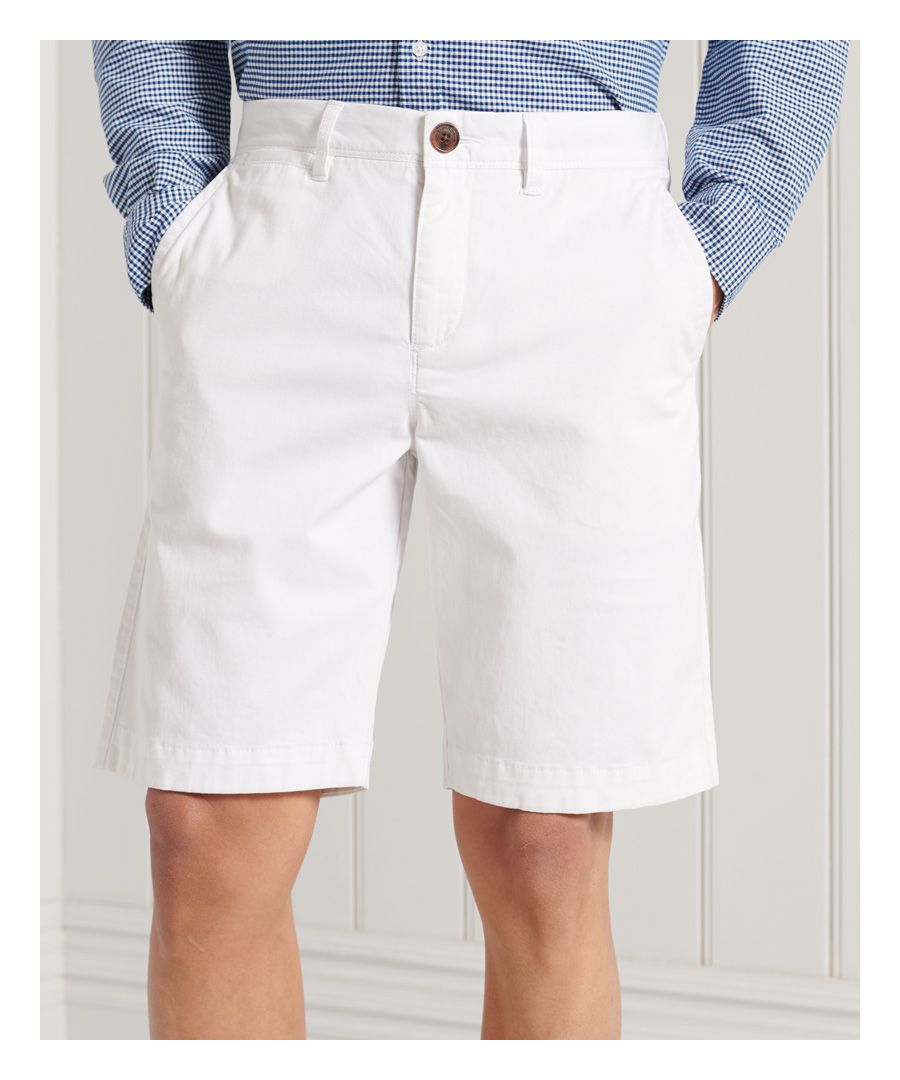 Superdry men's International shorts. These classic chino style shorts feature a five pocket design, zip and button fastening and belt loops. Finished with a Superdry patch log to the back.