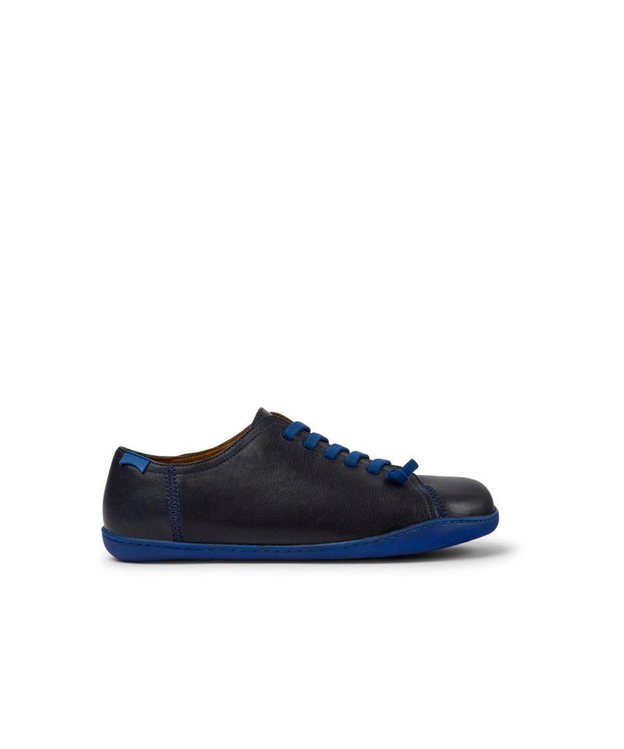 Blue leather men's shoes with 100% TPU outsoles (20% recycled).\n\nA Camper Icon that evolves with every season. Peu is functional simplicity inspired by walking barefoot. It is 360-degree stitched and built with a Strobel construction technique, guaranteeing unmatched flex and durability under any conditions.