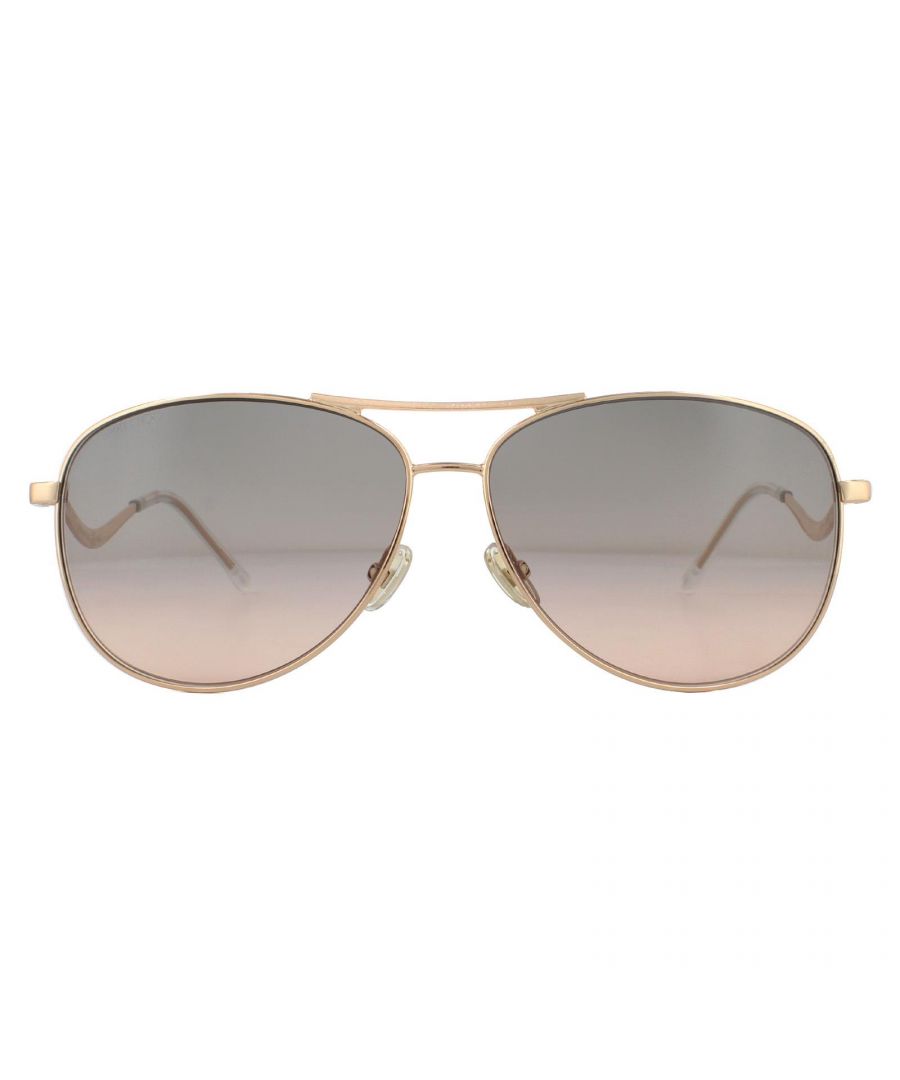 Jimmy Choo Sunglasses ESSY/S DDB FF Gold Copper Grey Fuchsia are a classic aviator style made from thin metal, with plastic temple tips and adjustable nose pads for extra comfort. The Jimmy Choo logo features on the wavy designed temples for brand authenticity
