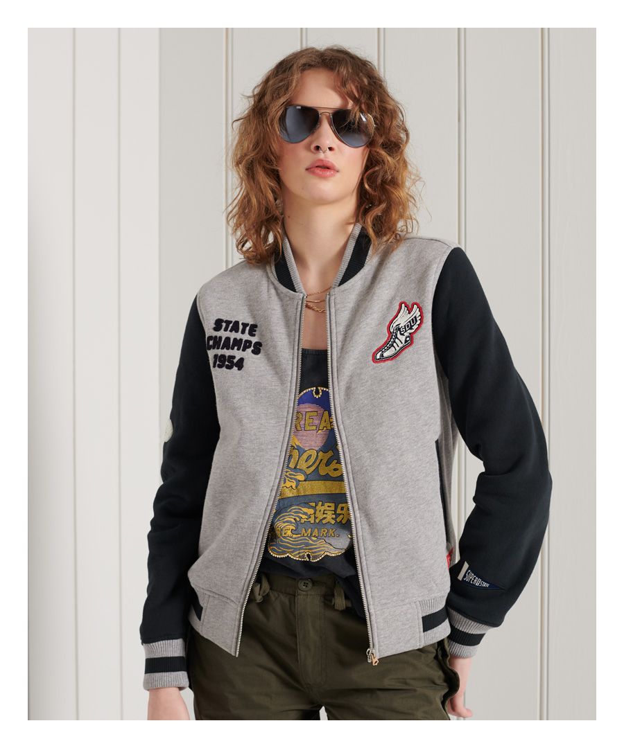 Get in the varsity mood with the Collegiate Scripted Baseball Bomber jacket. We've taken our inspiration from those classic Americana 1950s college looks to bring a contemporary feel to a classic zip through sweat.Relaxed fit – the classic Superdry fit. Not too slim, not too loose, just right. Go for your normal size.Contrasting long sleevesZip fasteningTwo pocketsSoft brushed liningRibbed cuffs and hemEmbroidered graphicsSignature logo patches
