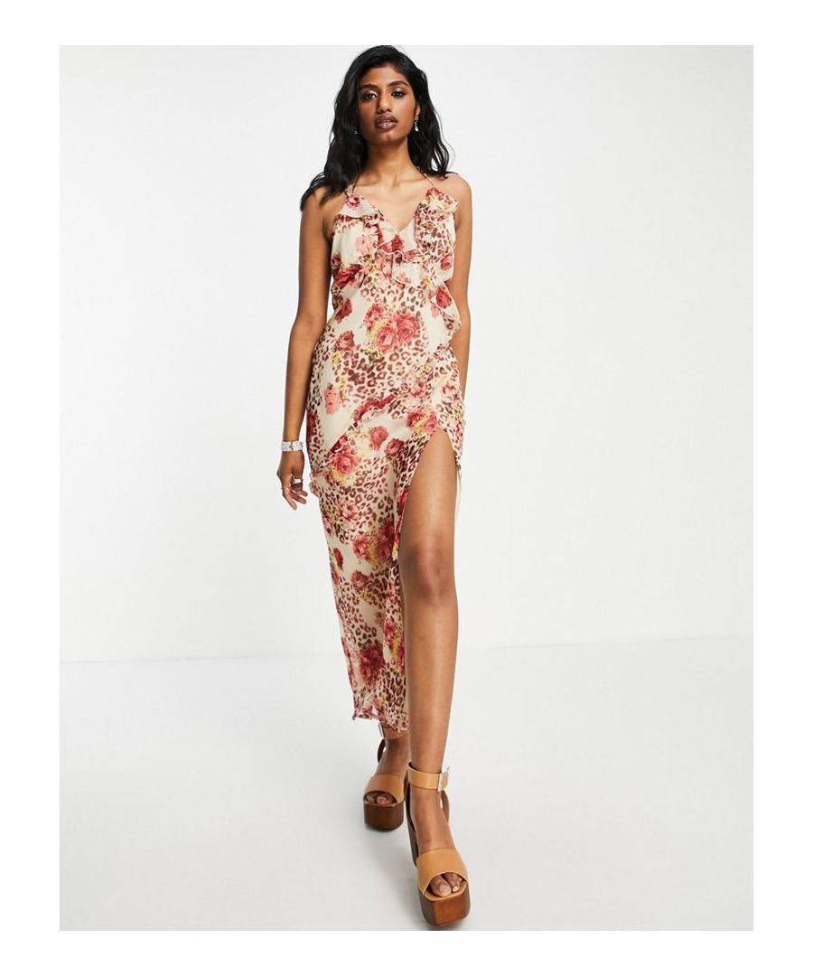Maxi dress by ASOS DESIGN Love at first scroll V-neck Cross-back straps Tie fastening Ruffle trims Split hem Regular fit  Sold By: Asos