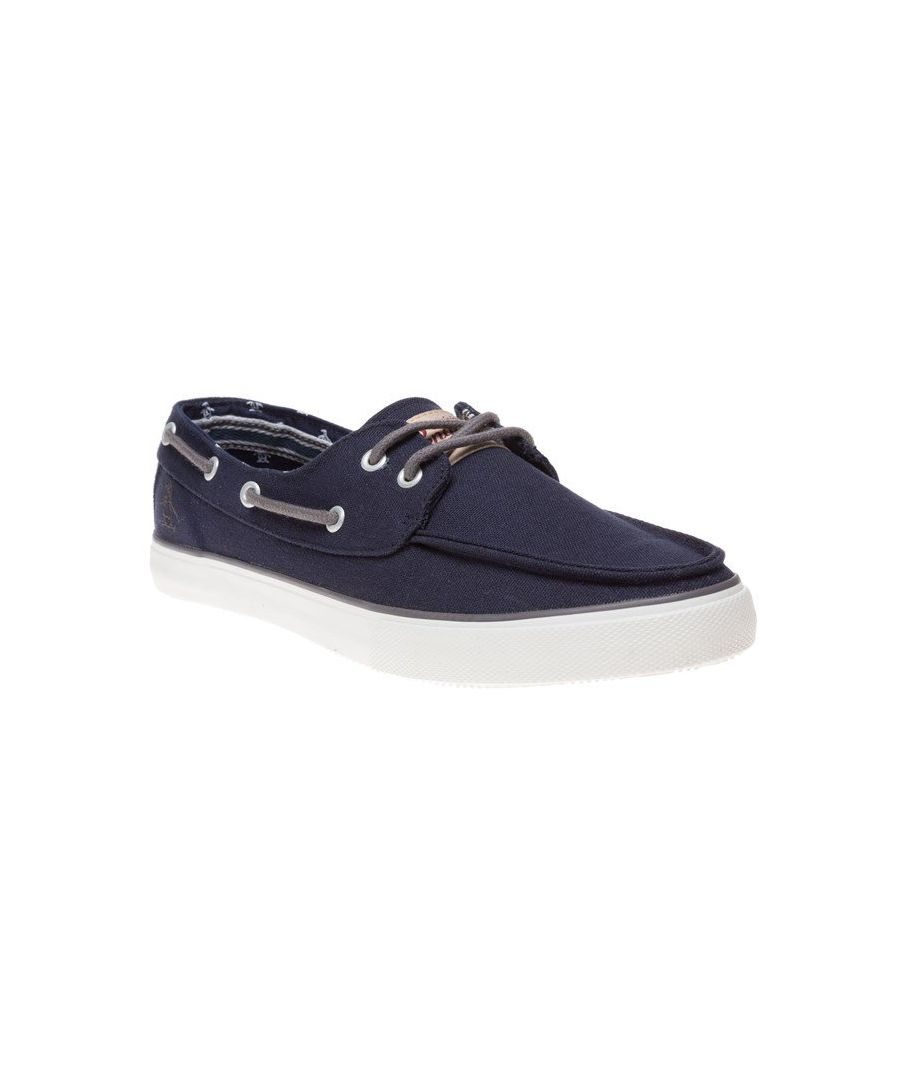 The Laguna Shoes From Penguin, In A Classic Boat Shoe Silhouette With Navy Canvas Uppers. Embroidered Penguin To The Side And Branding To The Tongue Create Signature Detailing While Metallic Eyelets Provide A Smart Finish. White Rubber Sole Completes.