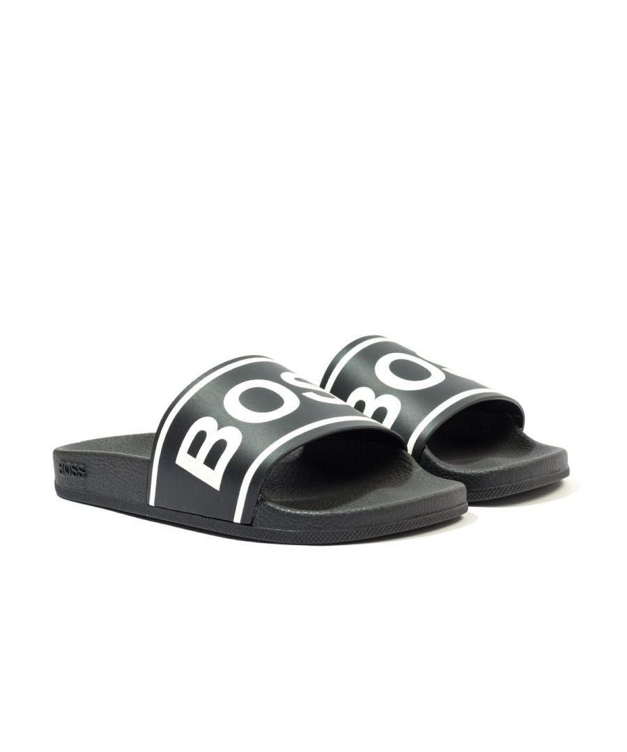 The Bay Contrast Logo & Stripe Slides from BOSS are a wardrobe staple for anyone. Featuring an ergonomically designed footbed for optimum comfort. Easy to wear, finished with the iconic BOSS logo contrast embossed across the strap with contrast stripe detailing. Synthetic Rubber Composition, Ergonomic Designed Footbed, Non Slip Sole, Contrast Stripe Detailing, Made in Italy, BOSS Branding.